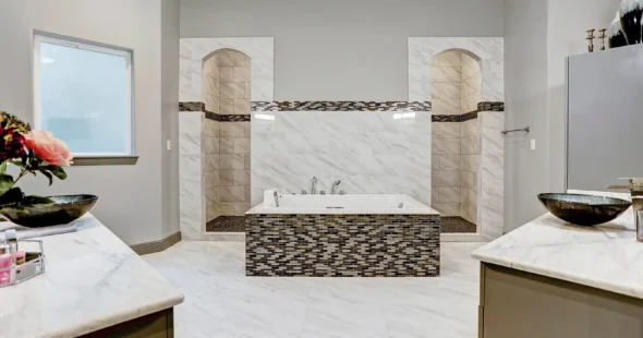 Luxury master bathroom with jetted tub and marble double vanity, Iconic Custom Home Builders Spring TX